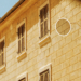 Illustration of Croatian apartment houses with an official registration tag, representing Croatia's 2027 Airbnb rules