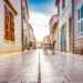 A quiet stone old-town street on a soft autumn morning in coastal Croatia