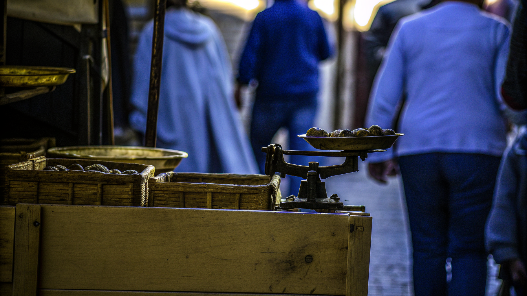 Fresh truffles in baskets and on a brass scale at a market stall during an Istrian truffle festival
