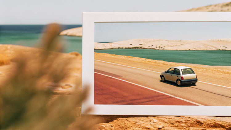 Car driving a winding Adriatic coastal road in Croatia, sea and islands below