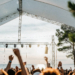 Crowd at an open-air summer music festival on the Croatian coast at dusk