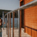 Swimmer entering clear Adriatic water from a rocky Croatian cove