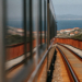 Illustration of a modern hybrid train travelling from Zagreb through the mountains toward Split