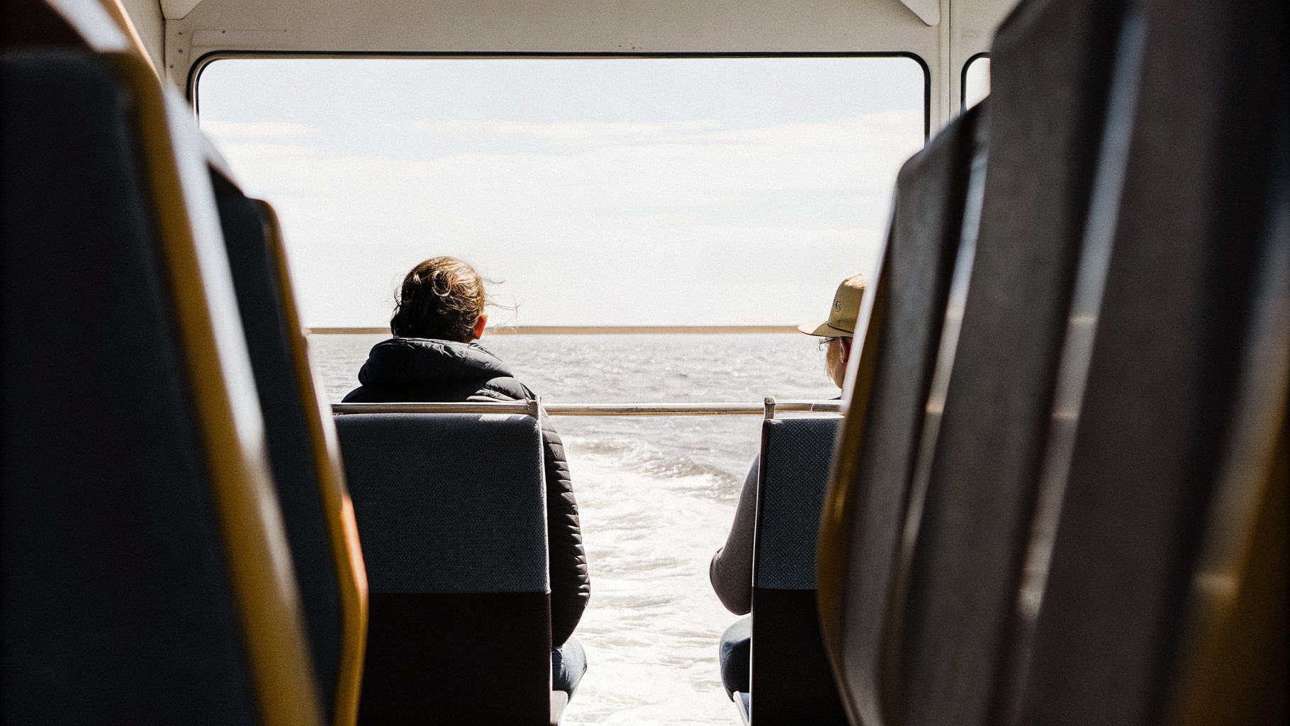 Passengers riding out choppy seas midship on a Croatian catamaran