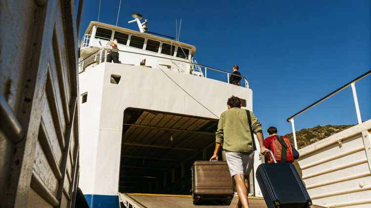 Car ferry loading vehicles beside a passenger catamaran in a Croatian port